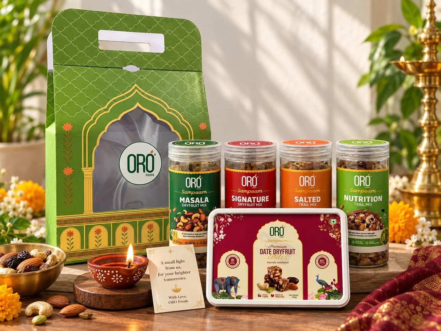 ORO FOODS Diwali hamper: green gift box, four jars, date bites, greeting card and diya