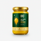 Jar of Oro A2 Desi Cow Ghee with a bowl of ghee on a natural background