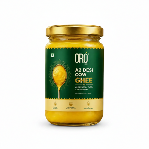 Jar of Oro A2 Desi Cow Ghee with a bowl of ghee on a natural background